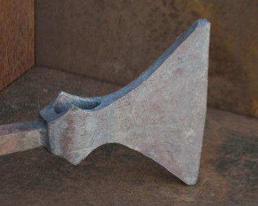 The blade has been drawn out to an intermediate form about 1/2" thick.