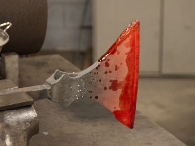 Here is the bit clasped into the axe body with some borax flux to aid in welding.