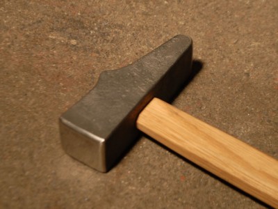 I haft all of my hammers with simple, straight handles of white oak or hickory.  The eye-hole has one full-length taper from top to bottom so ALL of the handle within it locks into the eye.