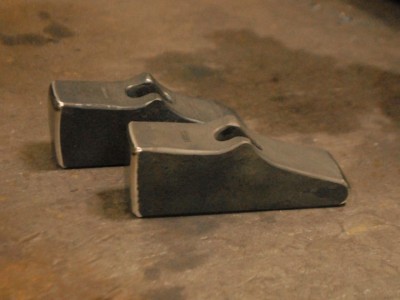 A pair of finished 3-pound hammers.  This asymmetric form is a bit tricky to manage and takes careful smithing right from the beginning.
